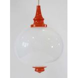 A 1970/80's ceiling light with a milky white globular glass shade and orange fittings Approx drop