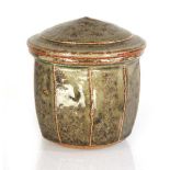 Attributed to Richard Batterham (1936-2021), a 1970's stoneware pot and cover decorated in a green