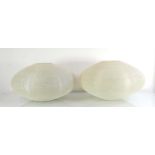 A pair of 1960/70's fibreglass ridged ceiling lights of squat form with a netting finish, di. 46 cm,