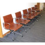 (G) A set of six desk chairs in the style of Charles & Ray Eames, with brown seats, chromed arms and