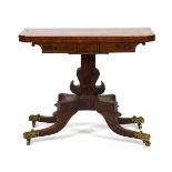 A William IV flame mahogany, rosewood banded and brass strung card table with canted corners, on a