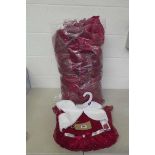 A bag containing a large quantity of girls dresses by Jona Michelle.