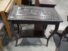 Carved side table with lower shelf
