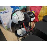 +VAT Nescafe Dolce Gusto coffee machine in black together with a Nespresso Dolce Gusto coffee