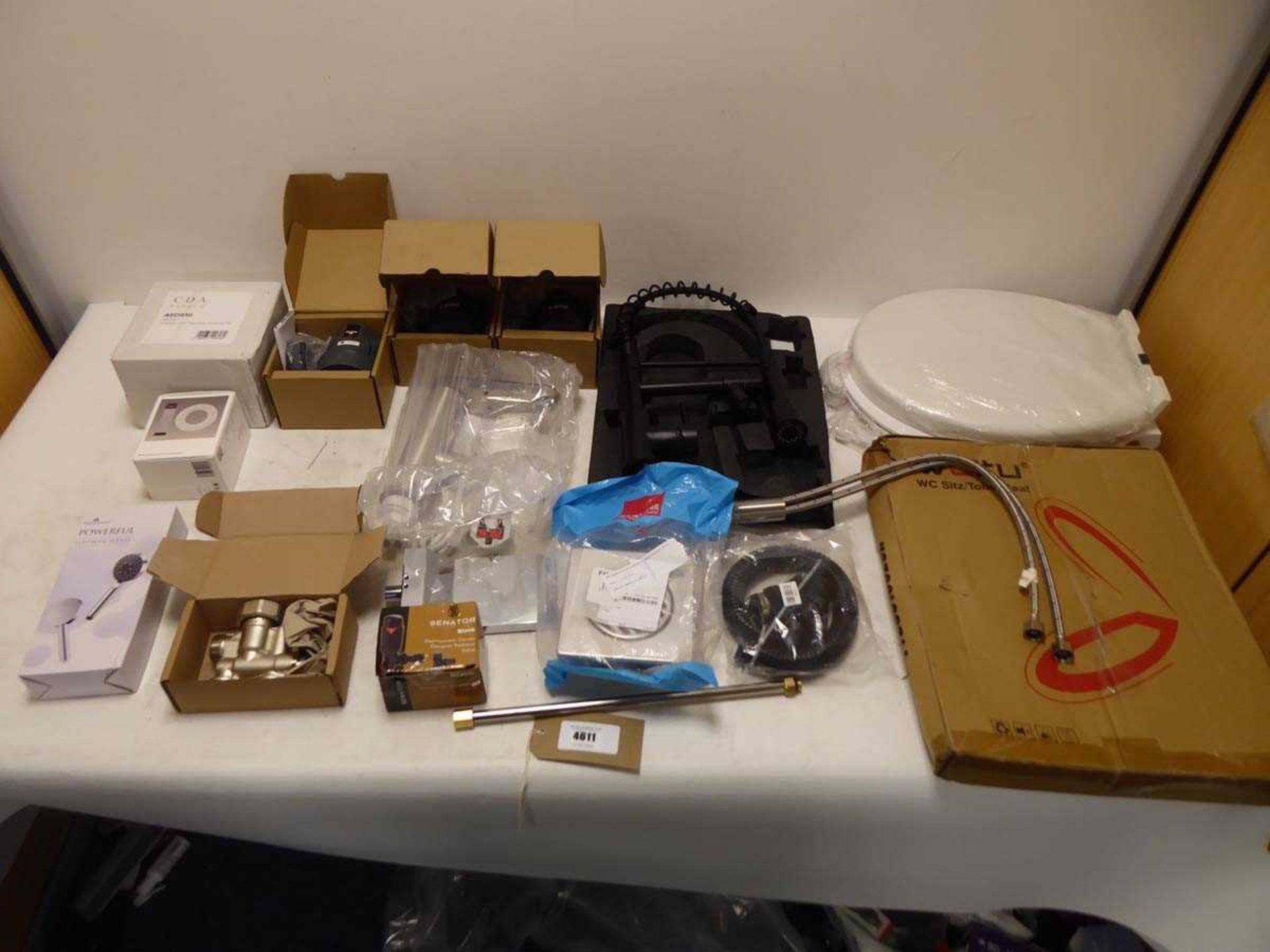 +VAT Selection of plumbing and bathroom to include kitchen taps, toilet seats, a water filter,