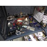 Cage containing costume jewellery, camera and candlesticks