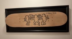 Keith Haring (1958–1990), “Untitled.” Three Figures, 1985. Black Marker On Skateboard Deck. Signe...