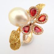 An exquisite 18k gold ring detailed with orange sapphire, pearl and brilliant