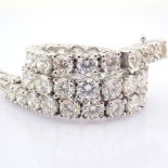 14K white gold tennis bracelet detailed with brilliant