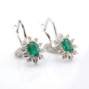 18K white gold cluster earring detailed with emerald and brilliant