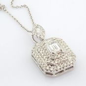 An exquisite 18k white gold necklace detailed with baguette and brilliant