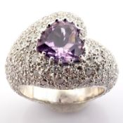 18K white gold ring. Detailed with 1.66 ct amethyst and 3.26 ct brilliant