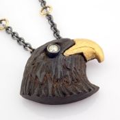 Ebony-carved eagle head necklace , detailed with brilliant diamonds and 18K gold on silver - Hand