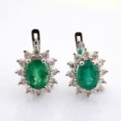 18K white gold cluster earrings, detailed with vibrand emerald and brilliant