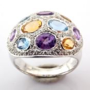 18K white gold ring detailed with semi precious stones and brilliant