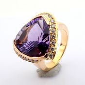 An exquisite 18K cluster ring detailed with amethyst and brilliant