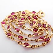 18K rose gold necklace detailed with rubies and brilliant