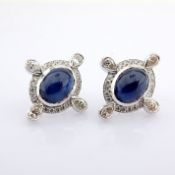 18K white gold earrings detailed with sapphire and