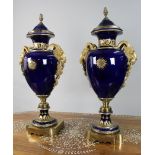 Title: Pair of Fine Sevres Style Cobalt Blue Rams Head Lidded Urns Description: Pair of Fine