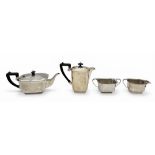 AN ART DECO SILVER TEA SET COMPRISING TEA POT, HOT WATER POT, MILK JUG AND SUGAR BOWL