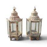 A PAIR OF CAST IRON HEXAGONLE LANTERNS WITH GLASS PANEL SIDES