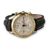 AN OMEGA STEEL AND GOLD SPEEDMASTER AUTOMATIC TRIP CALENDAR CHRONOGRAPH WATCH