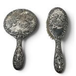 A SILVER HAND MIRROR AND HAIR BRUSH, DECORATED WITH JOSHUA REYNOLDS 'ANGELS'