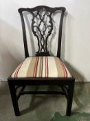 A late 18th, early 19th century chair with reupholstered seat in striped fabric.