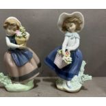 Two Lladro figures of young girls with flowers in different colourways.