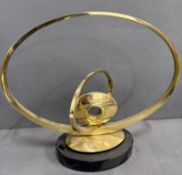 In the manner of Carmello Capelli on abstract brass sculpture on black marble base
