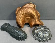 A selection of three jelly moulds.