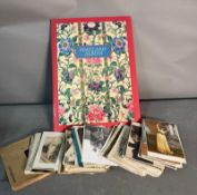A fantastic collection of vintage postcards including an album, a variety of themes including