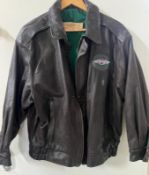 A Morgan leather flying jacket by The Cockpit Clothing Co, Southampton with a brass official plate