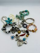 A selection of costume jewellery including some silver items, various styles and finishes.