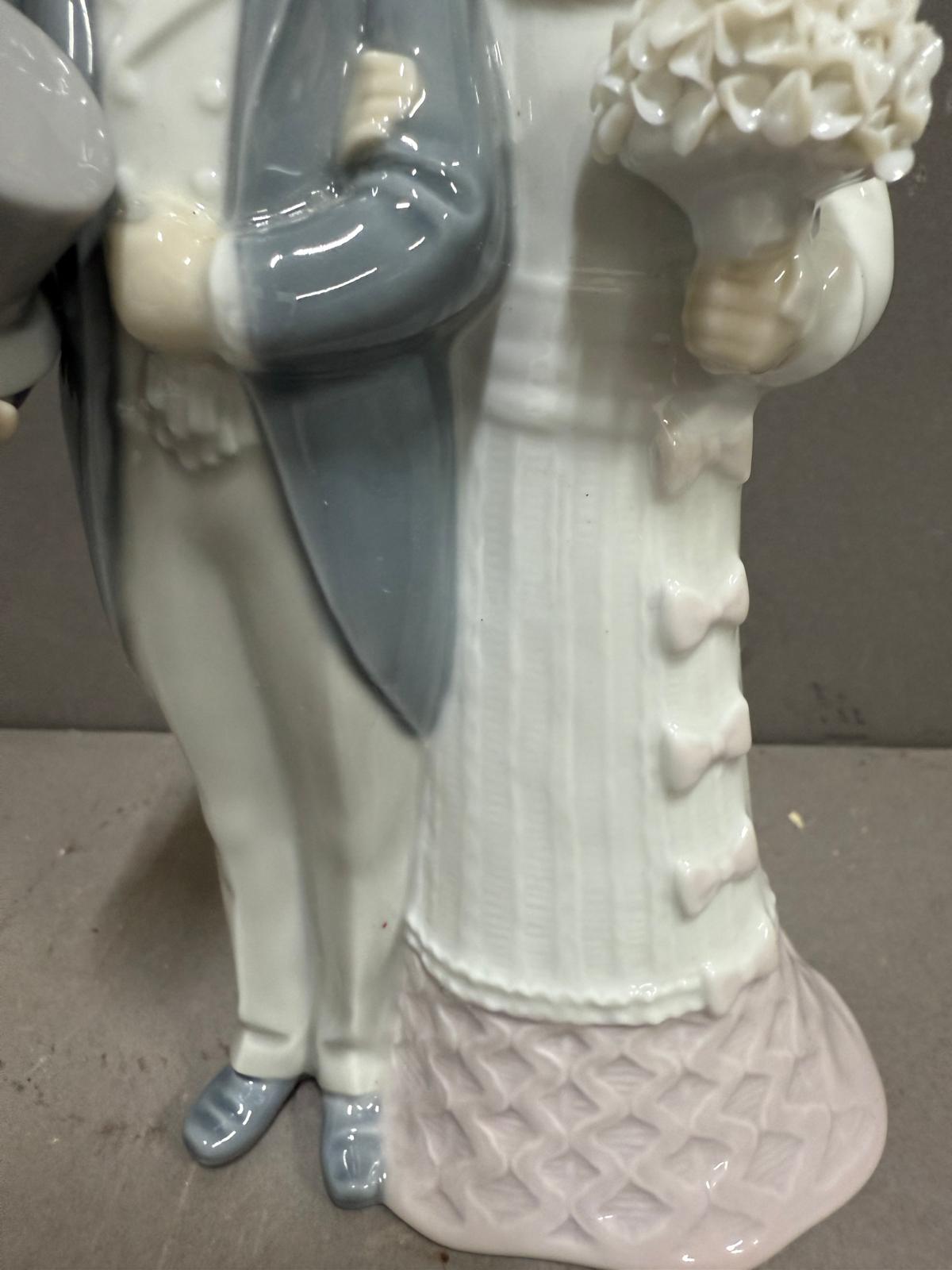 A Lladro figure of a bride and groom on their wedding day. - Image 4 of 4