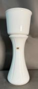 A white Bay Keramik ceramic floor vase and planter