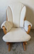 A Dutalier glider rocking chair