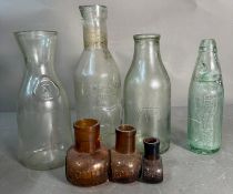 A selection of vintage bottles to include graduated Bovril jars and an Absolute pure milk bottle