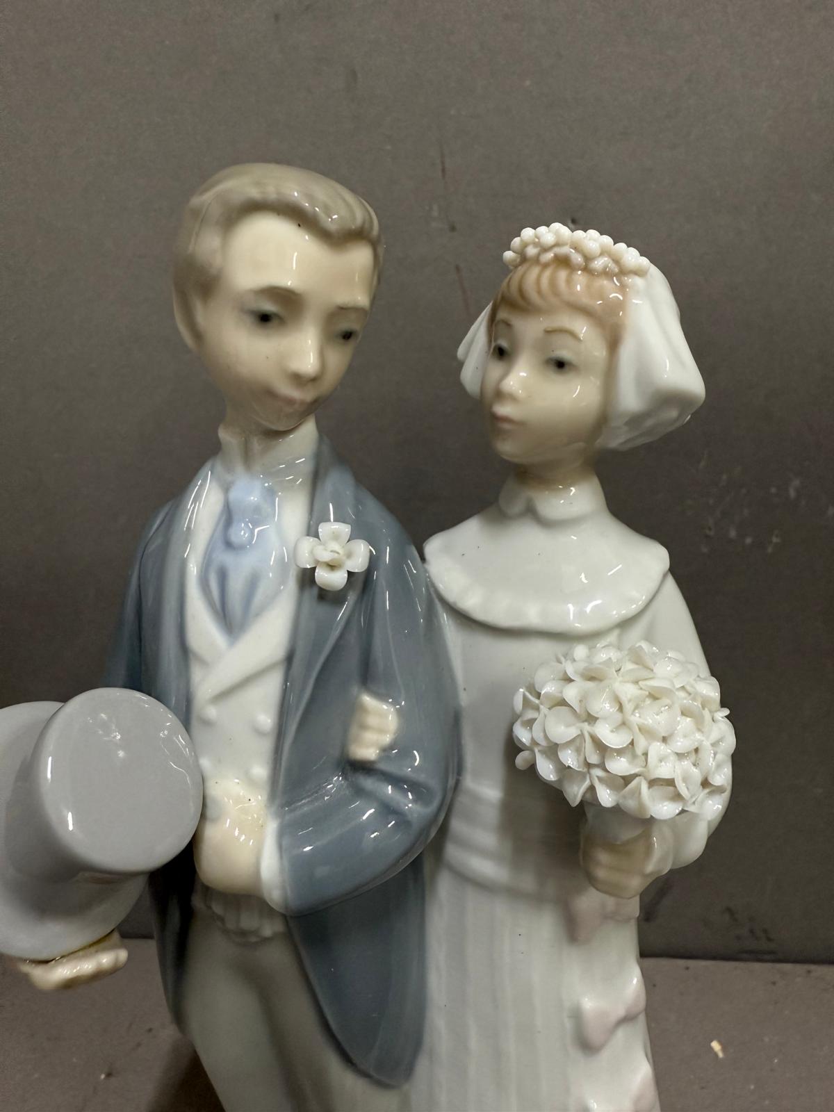 A Lladro figure of a bride and groom on their wedding day. - Image 3 of 4