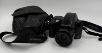 An Olympus Centurion camera and case