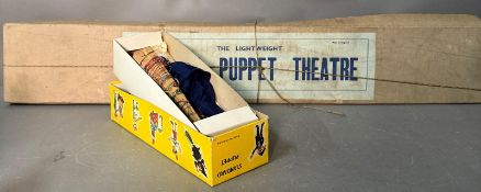 A Pelham Puppet Theatre along with a Pelham Puppet Policeman, both in original boxes.