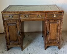 Ladies oak desk with tooled detail and green leather top (H74cm W97cm D48cm)