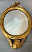 A small oval old painted toilet mirror. 28x47
