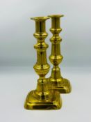 A pair of vintage brass candlesticks, approximate height 22cm.
