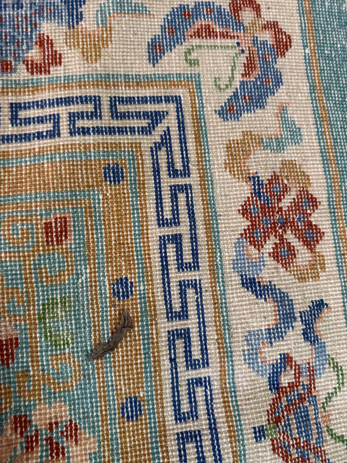 A wool rug, blue grounds with a floral border and central pattern (220cm x 124cm) - Image 3 of 4