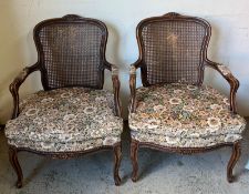A pair of Rocco style chairs with cane backs