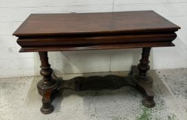 A mahogany console table on twin turned supports with cross streatcher. Height 70cm 52x110