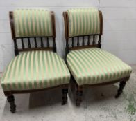A pair of aesthetic movement side chairs with green and yellow striped seats and backs