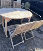 Teak garden extendable table with four chairs by Lindsey along with an umbrella (182cm x 90cm)