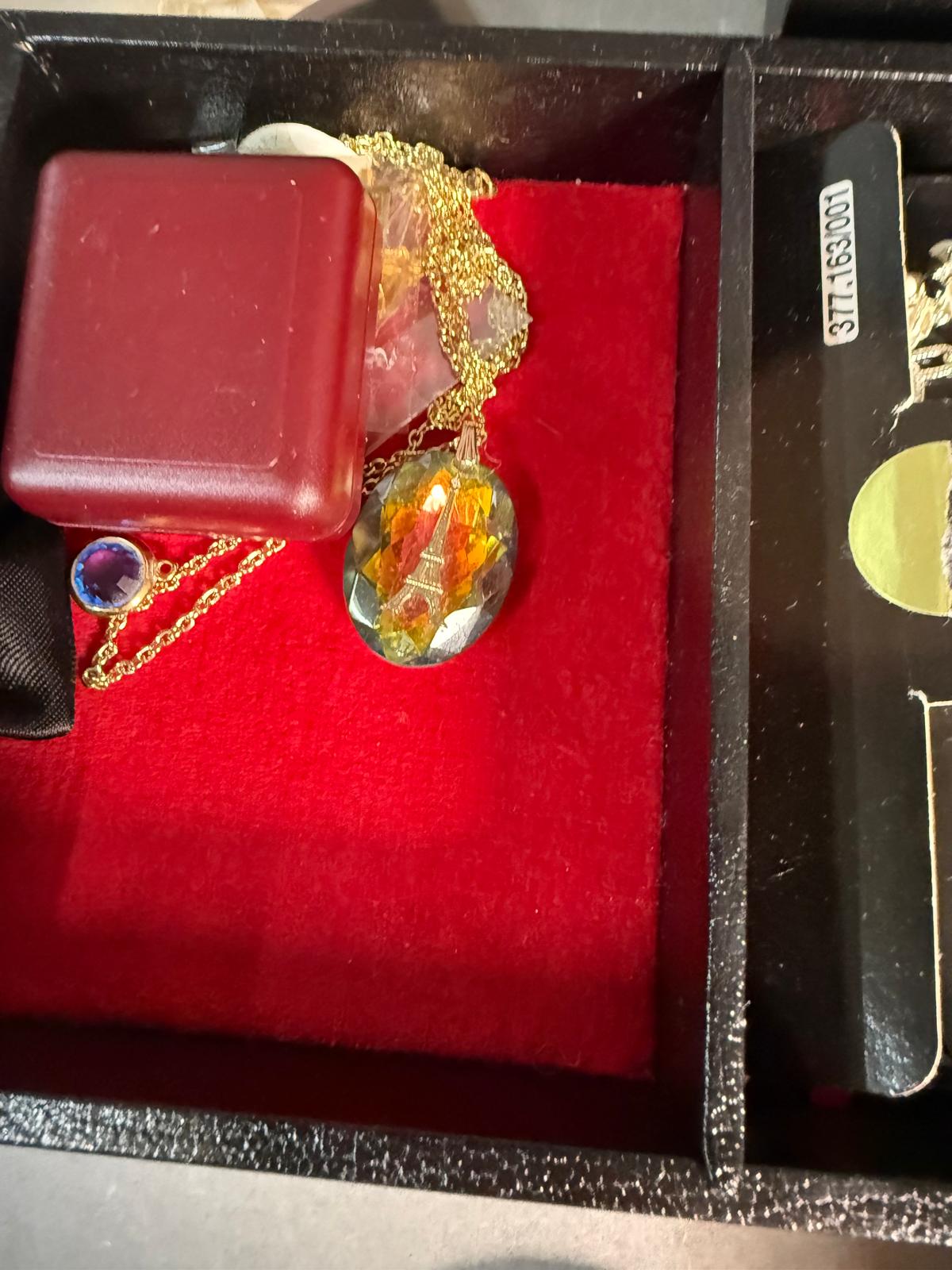 A selection of costume jewellery in a black jewellery box, a variety of styles and finishes to - Image 3 of 6